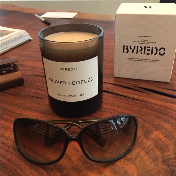 Oliver Peoples wrap-around style sunnies.